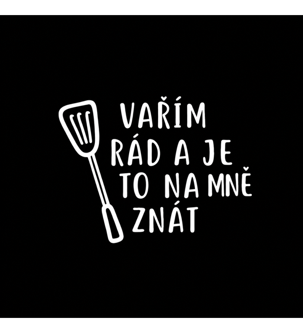 Černá zástěra s nápisem Vařím rád a je to na mě znát